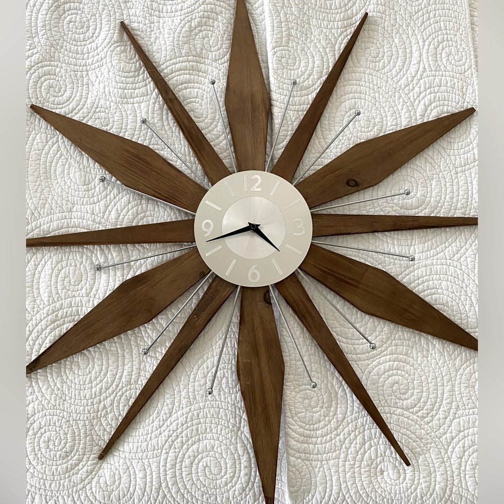 Beautiful vintage mid century clock 30 by 30. Runs on a battery and works.